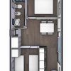 Pianta di una casa mobile con due camere da letto, bagno e cucina.